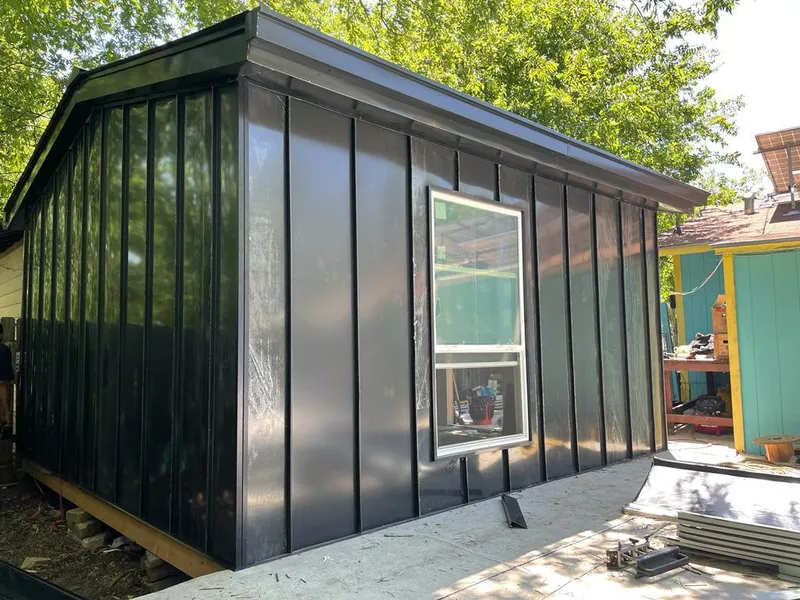 Black standing seam metal wall panels for Roof Inspection in Norwell